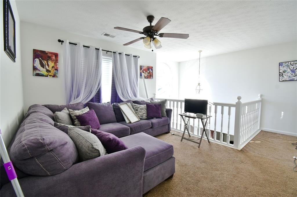 12140 Dominion Drive Hampton, GA 30228 - Photo 33 of 52 a living room with furniture and a large window