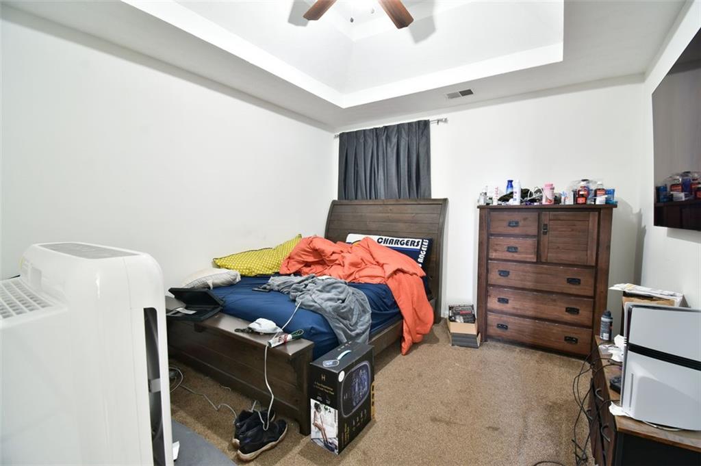 12140 Dominion Drive Hampton, GA 30228 - Photo 38 of 52 a bedroom with a bed and a cabinets