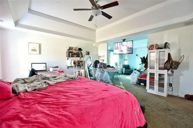 a bedroom with bed and a window