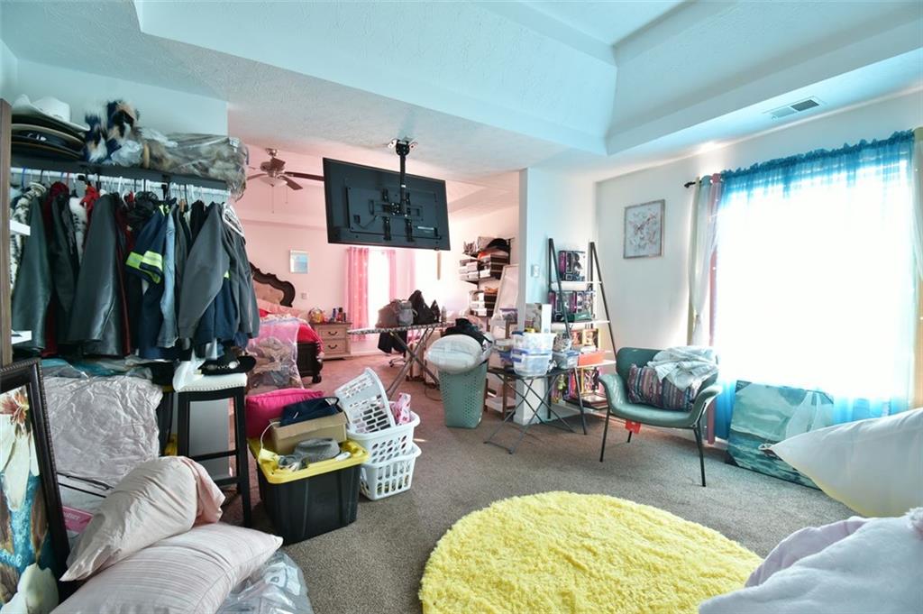 12140 Dominion Drive Hampton, GA 30228 - Photo 46 of 52 a living room with furniture and a flat screen tv