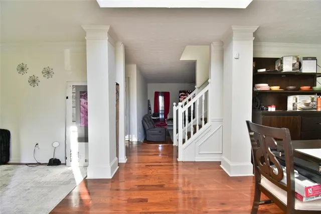 a view of a hallway with furniture and staircase