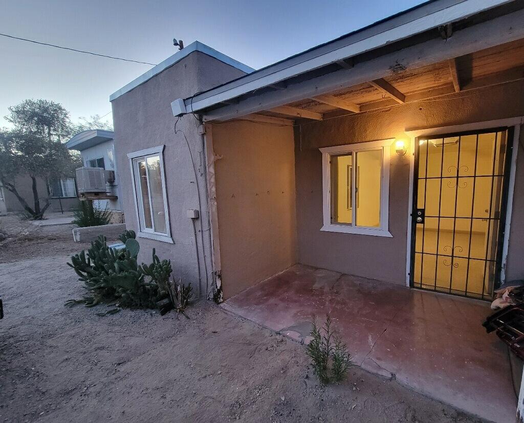 6746 Adobe Road, Unit 15 Twentynine Palms, CA 92277 - Photo 1 of 9 a view of backyard with potted plants