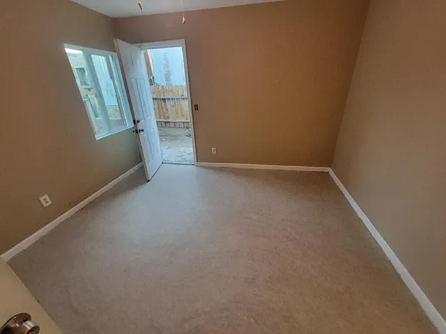 a kitchen with sink cabinets and window