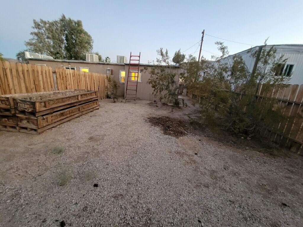 6746 Adobe Road, Unit 15 Twentynine Palms, CA 92277 - Photo 9 of 9 a view of a backyard with plants and outdoor seating
