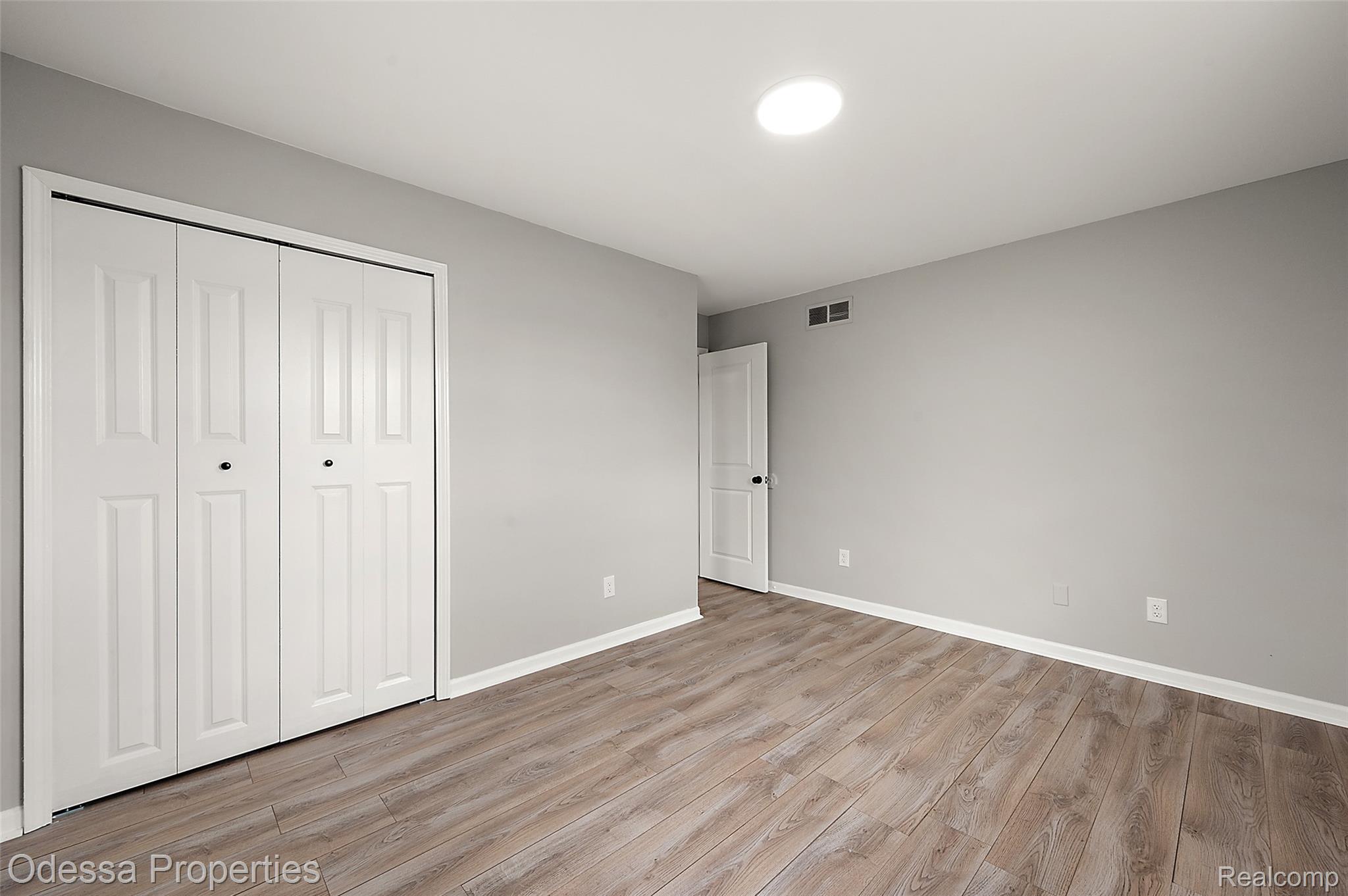 1442 Riley Center Road Memphis, MI 48041 - Photo 39 of 62 Unfurnished bedroom with a closet and light wood-style flooring