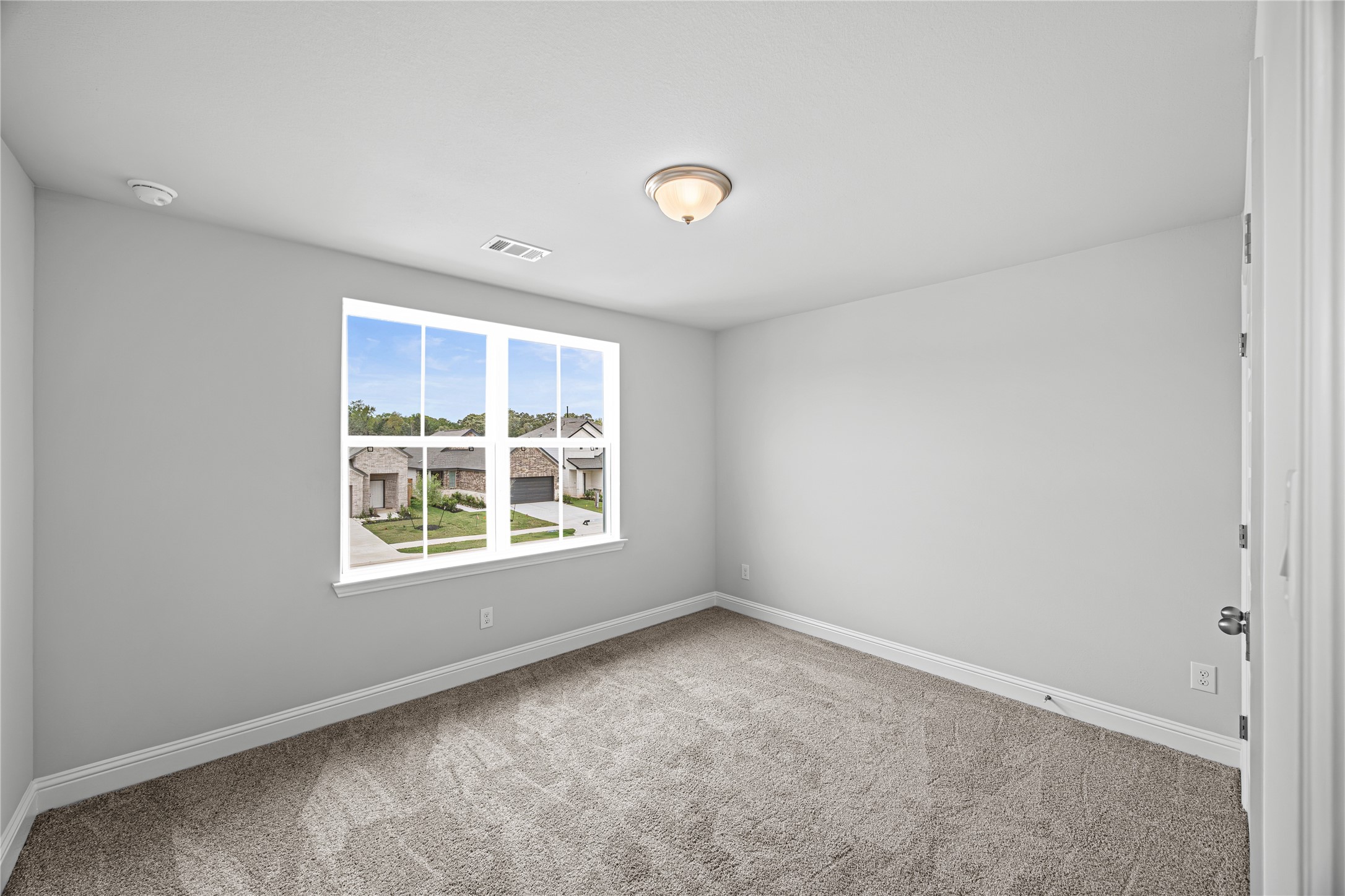 9460 Hard Rock Road Conroe, TX 77303 - Photo 12 of 17 an empty room with a window
