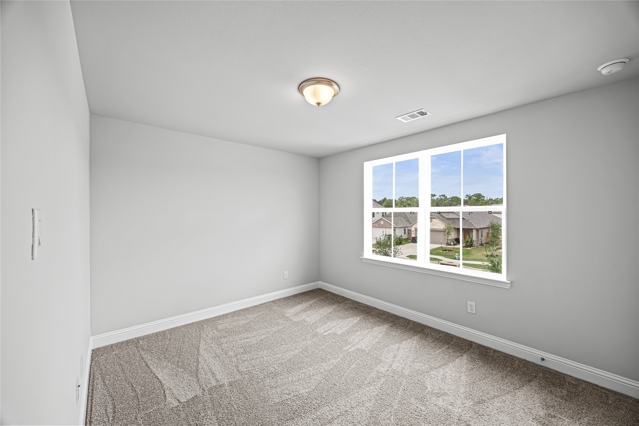 9460 Hard Rock Road Conroe, TX 77303 - Photo 13 of 17 an empty room with a window