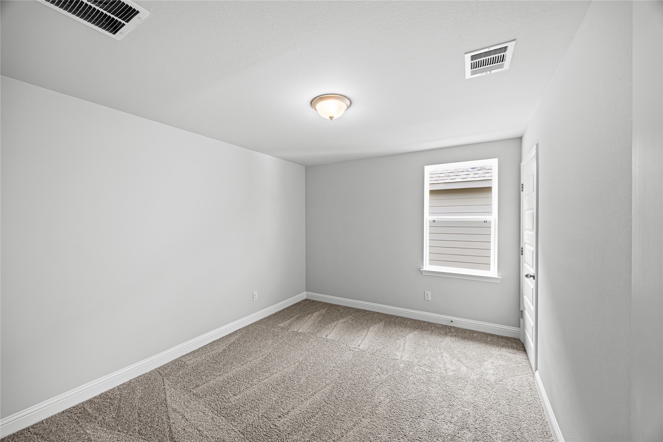 9460 Hard Rock Road Conroe, TX 77303 - Photo 14 of 17 an empty room with a window