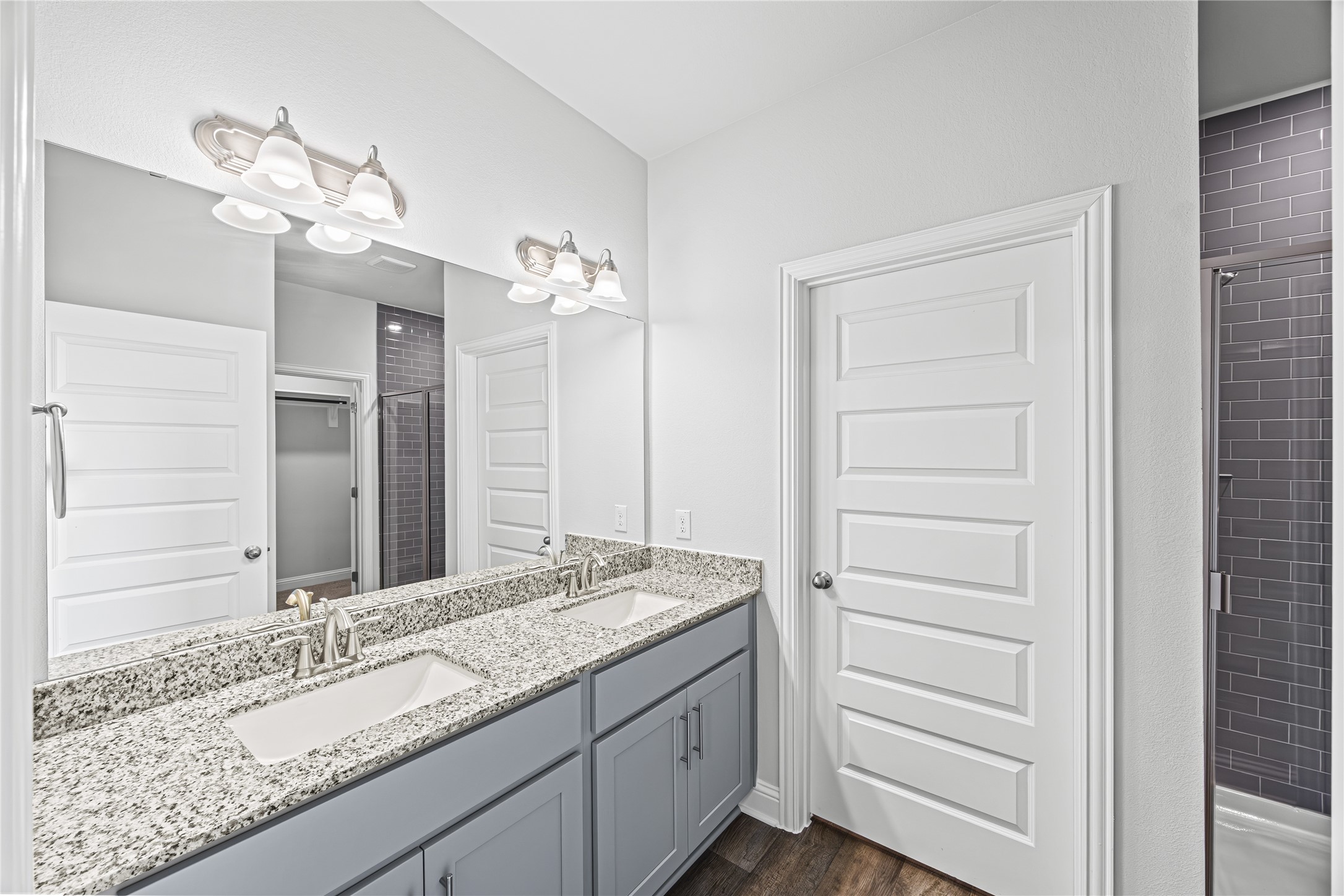 9460 Hard Rock Road Conroe, TX 77303 - Photo 9 of 17 a bathroom with a granite countertop sink and a mirror