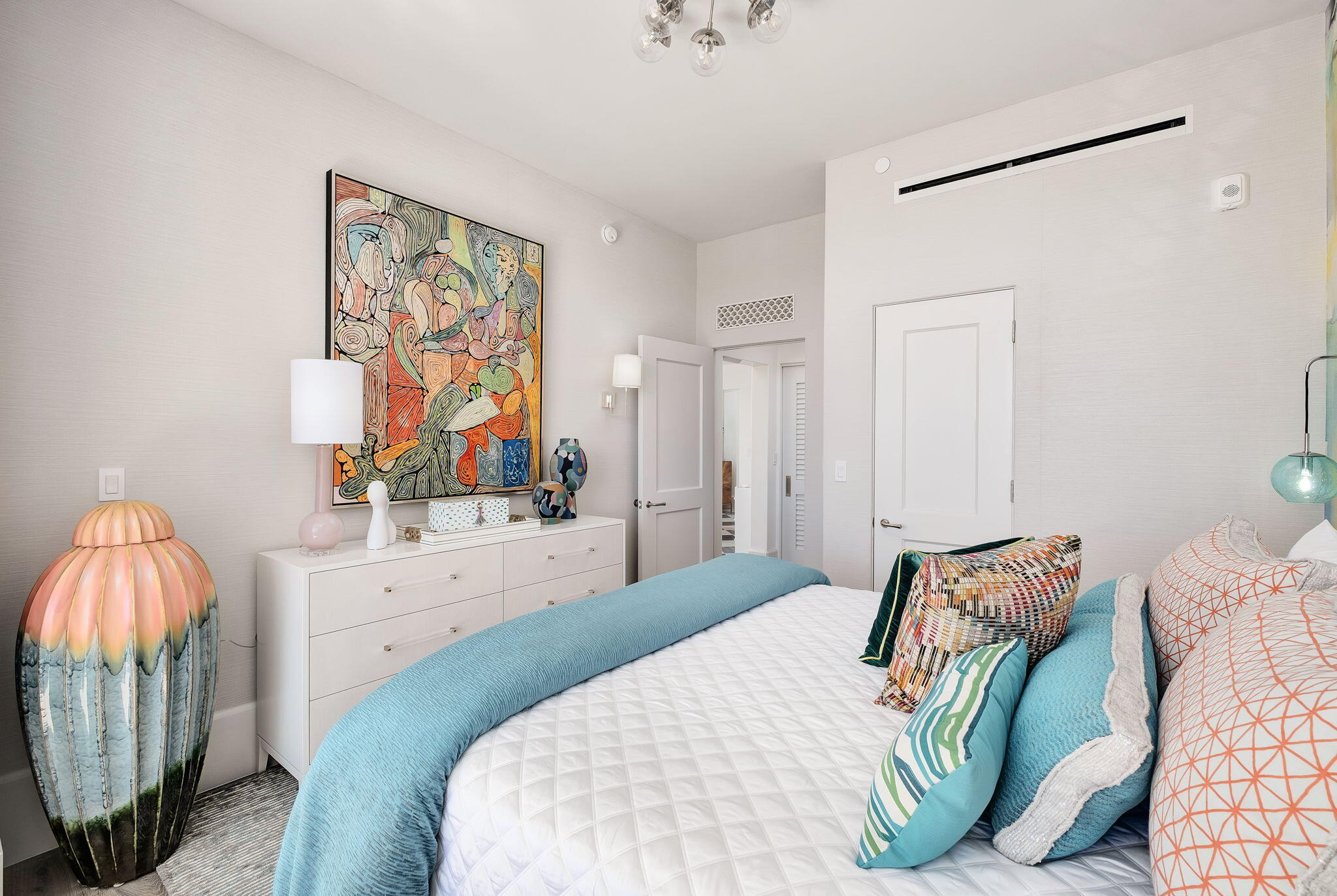 27 Admiralty Row, Unit 302 Alys Beach, FL 32461 - Photo 15 of 33 a bedroom with a bed and a painting on the wall