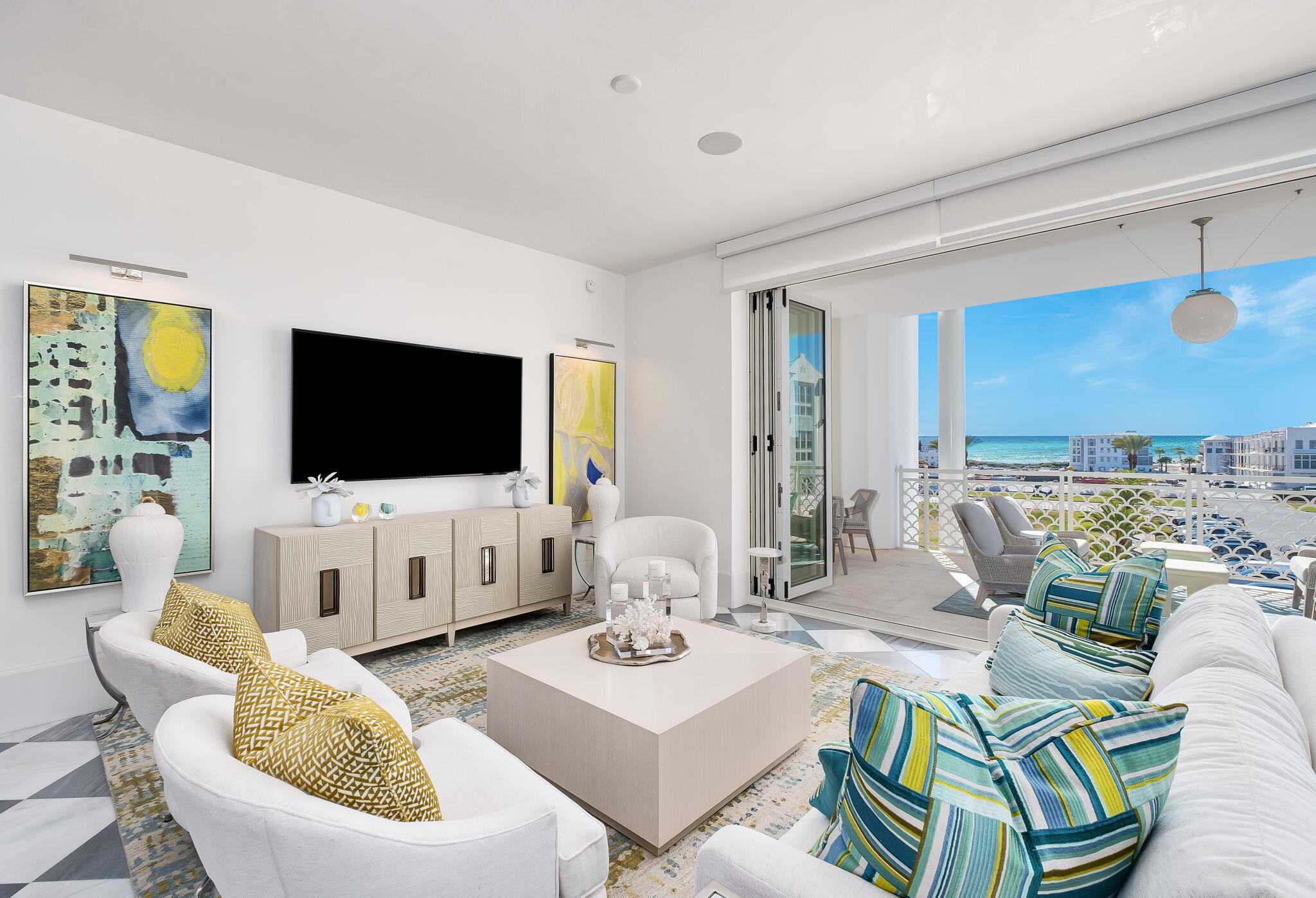 27 Admiralty Row, Unit 302 Alys Beach, FL 32461 - Photo 3 of 33 a living room with furniture and a flat screen tv