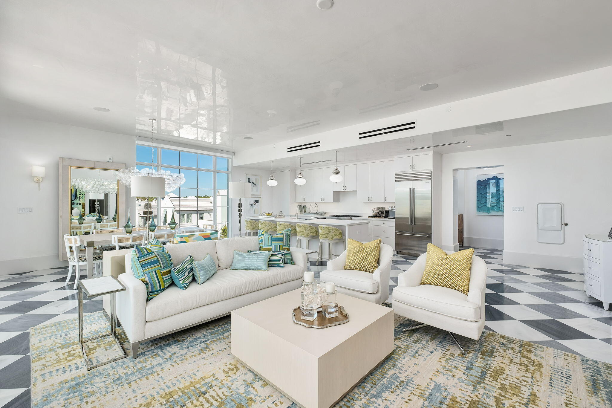 27 Admiralty Row, Unit 302 Alys Beach, FL 32461 - Photo 4 of 33 a living room with furniture and a dining table with kitchen view