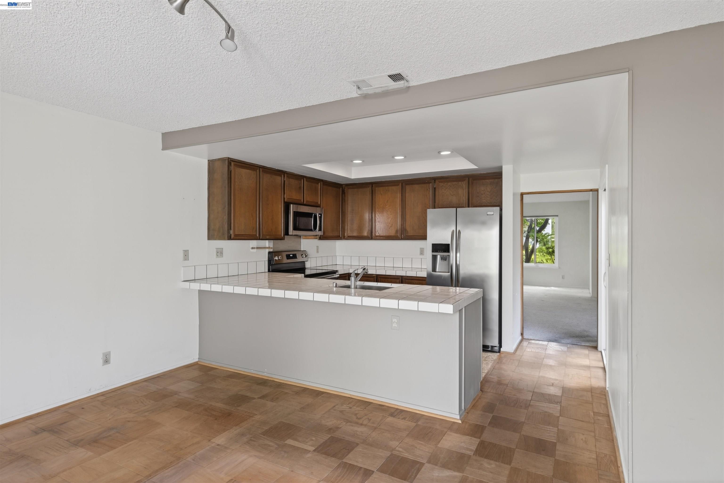202 Baywood Road Alameda, CA 94502 - Photo 12 of 26 a view of kitchen with sink microwave and refrigerator