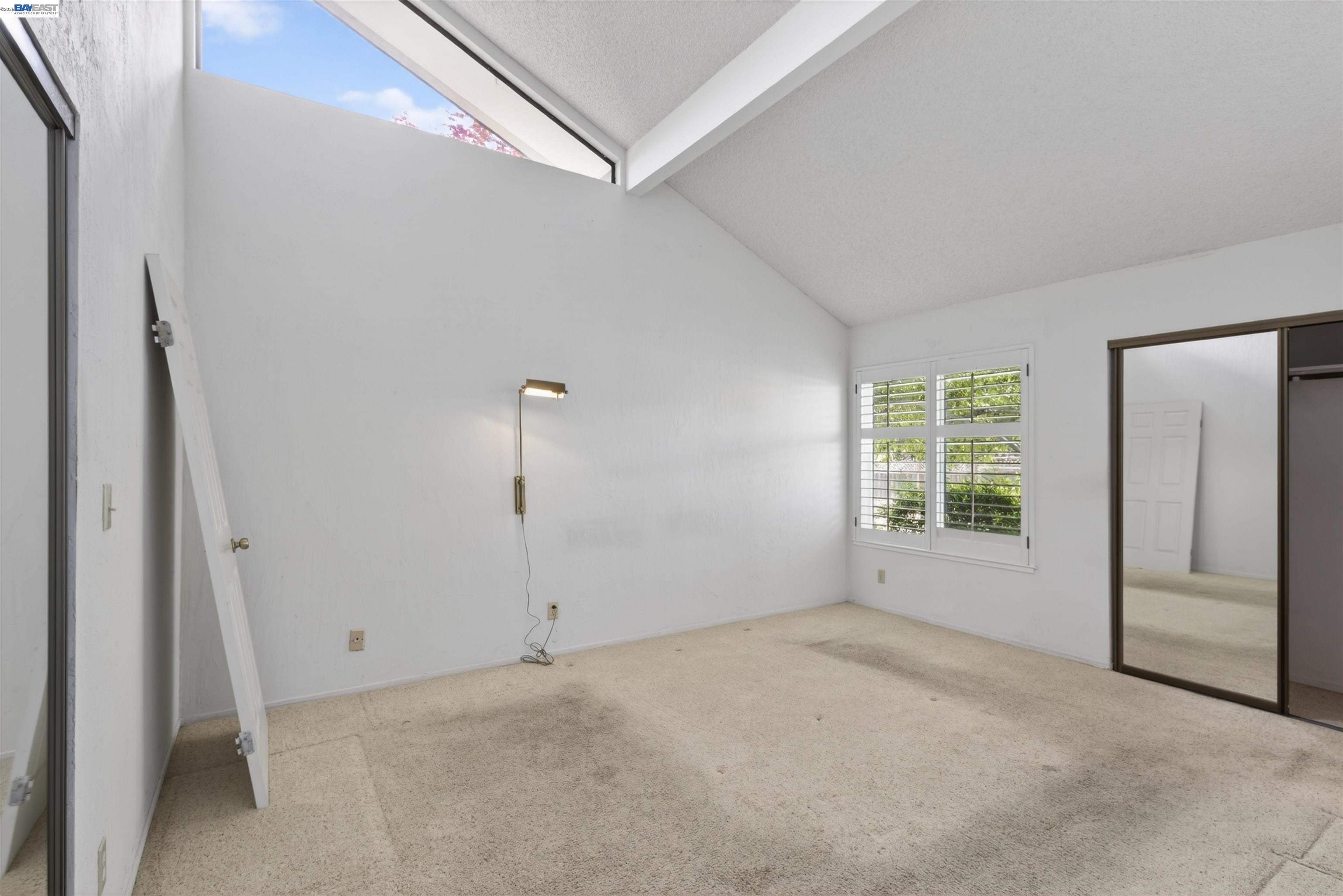 202 Baywood Road Alameda, CA 94502 - Photo 20 of 26 an empty room with windows