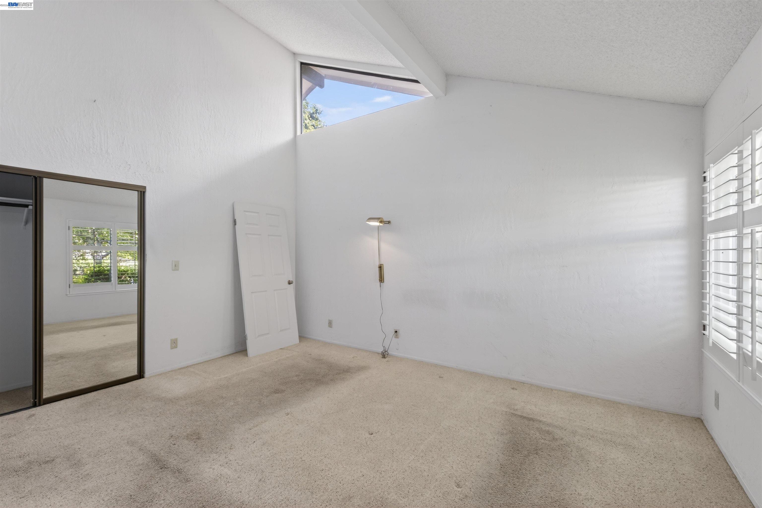 202 Baywood Road Alameda, CA 94502 - Photo 21 of 26 an empty room with windows and closet