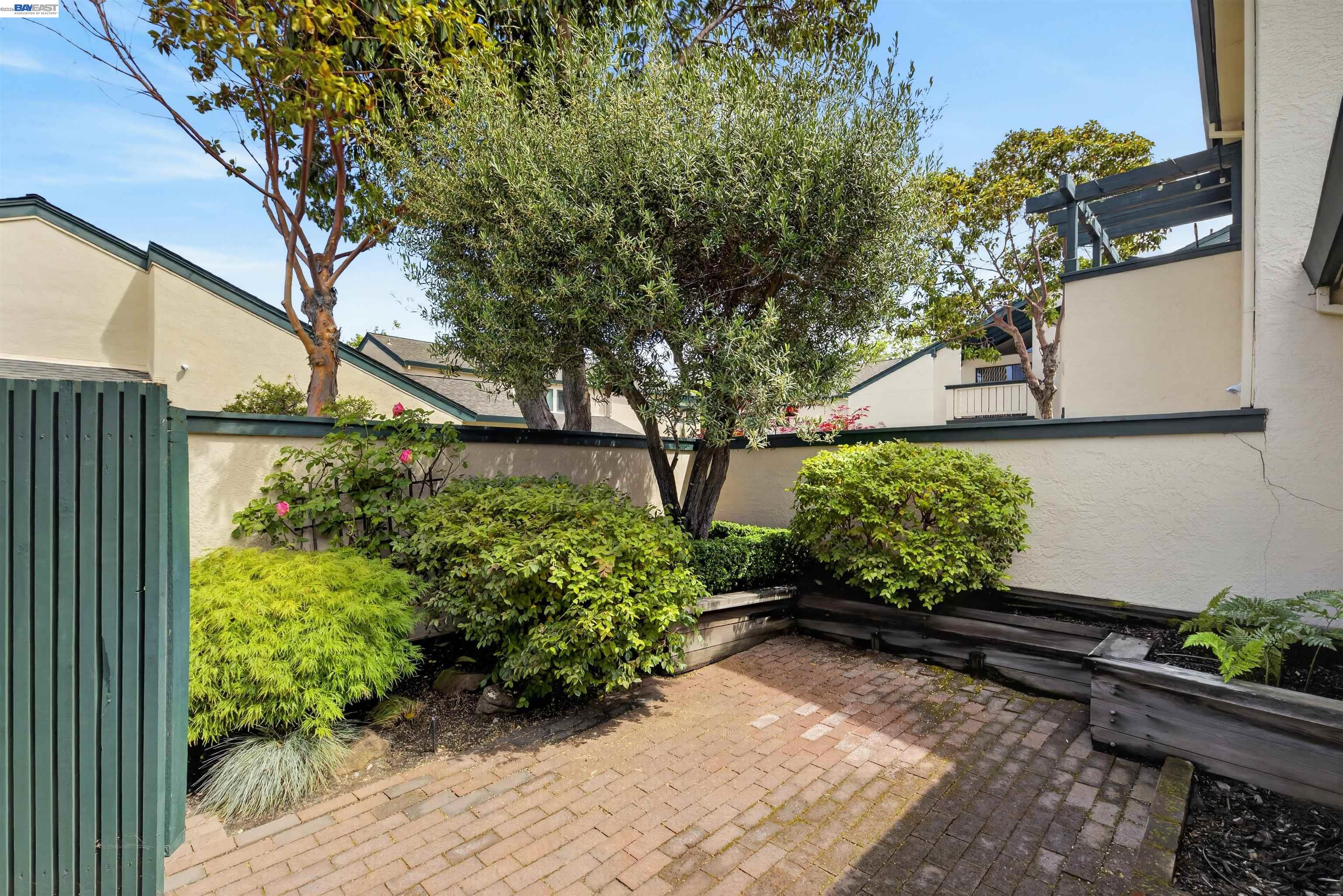 202 Baywood Road Alameda, CA 94502 - Photo 23 of 26 a bunch of flowers are in a garden