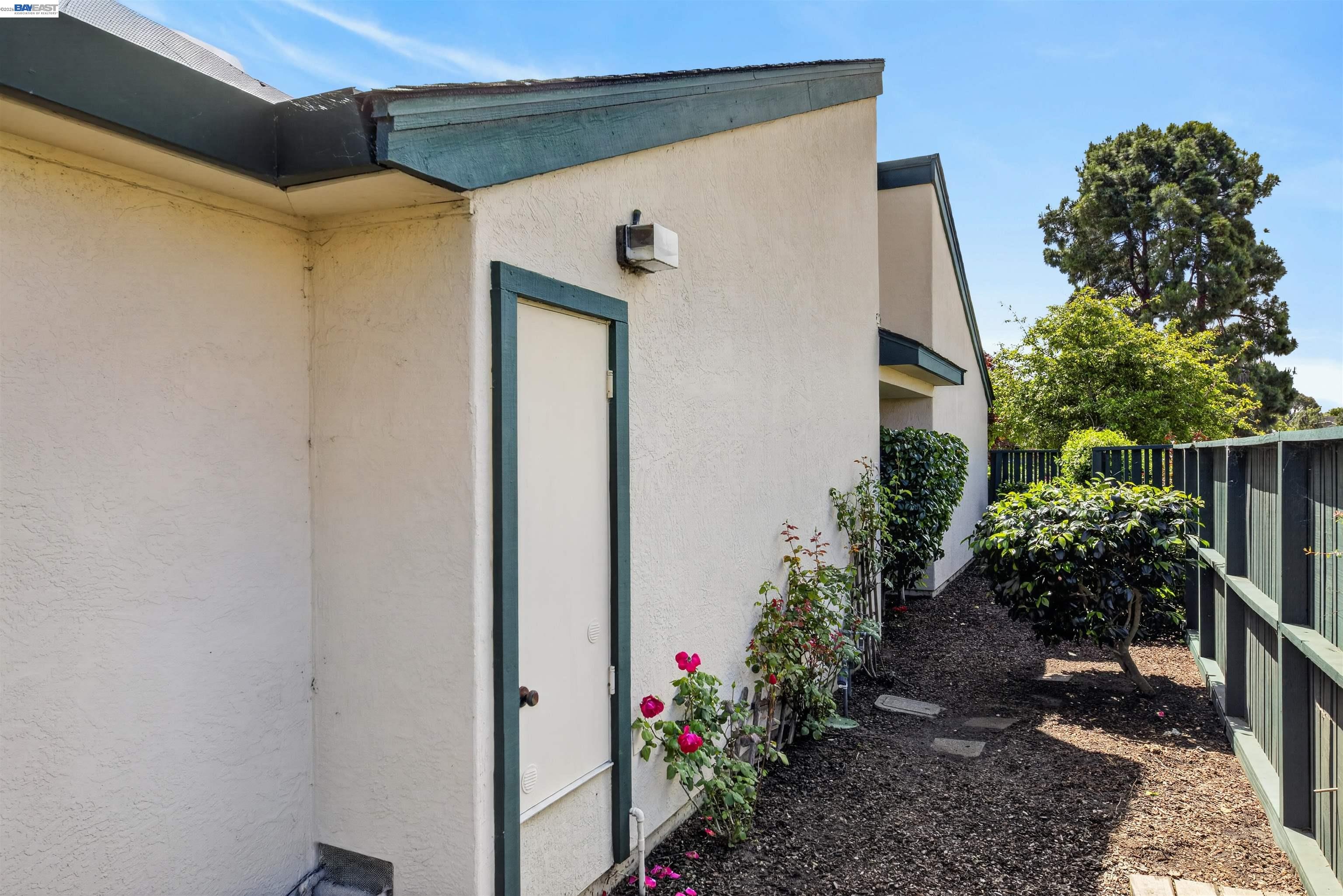 202 Baywood Road Alameda, CA 94502 - Photo 26 of 26 a view of a pathway of a house with potted plants