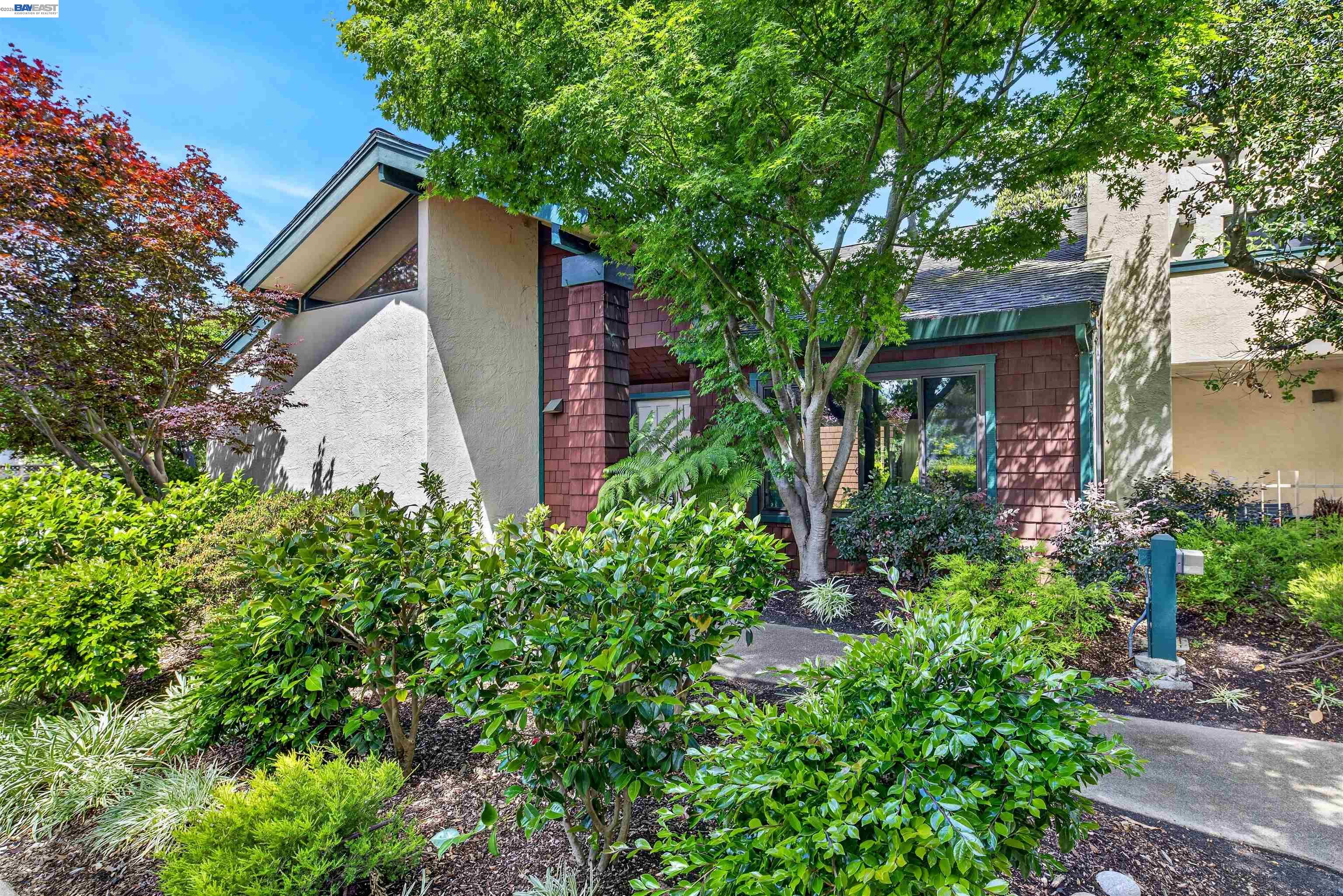202 Baywood Road Alameda, CA 94502 - Photo 3 of 26 a view of a house with a yard and garden
