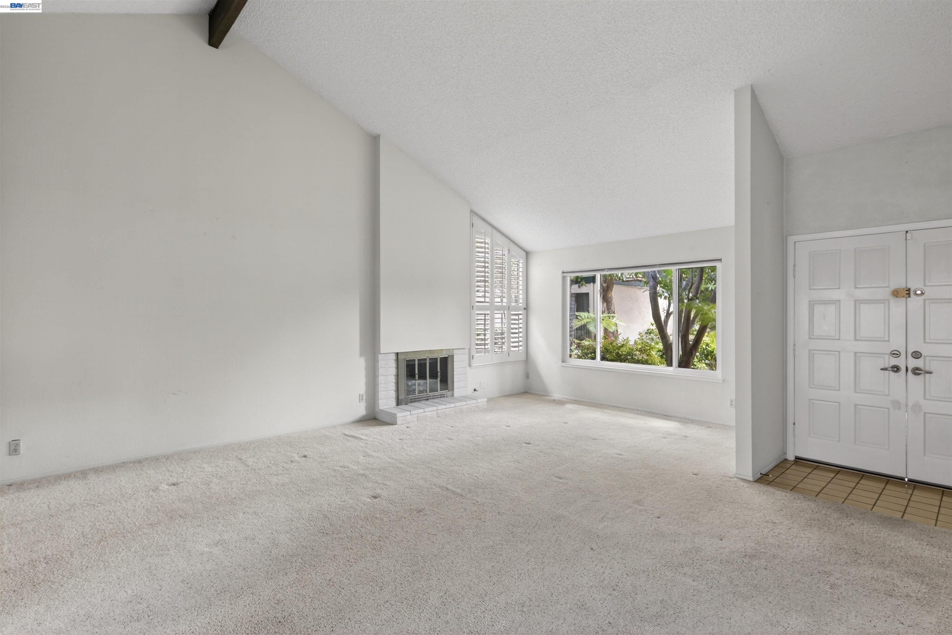 202 Baywood Road Alameda, CA 94502 - Photo 8 of 26 a view of a livingroom with an empty space and a fireplace