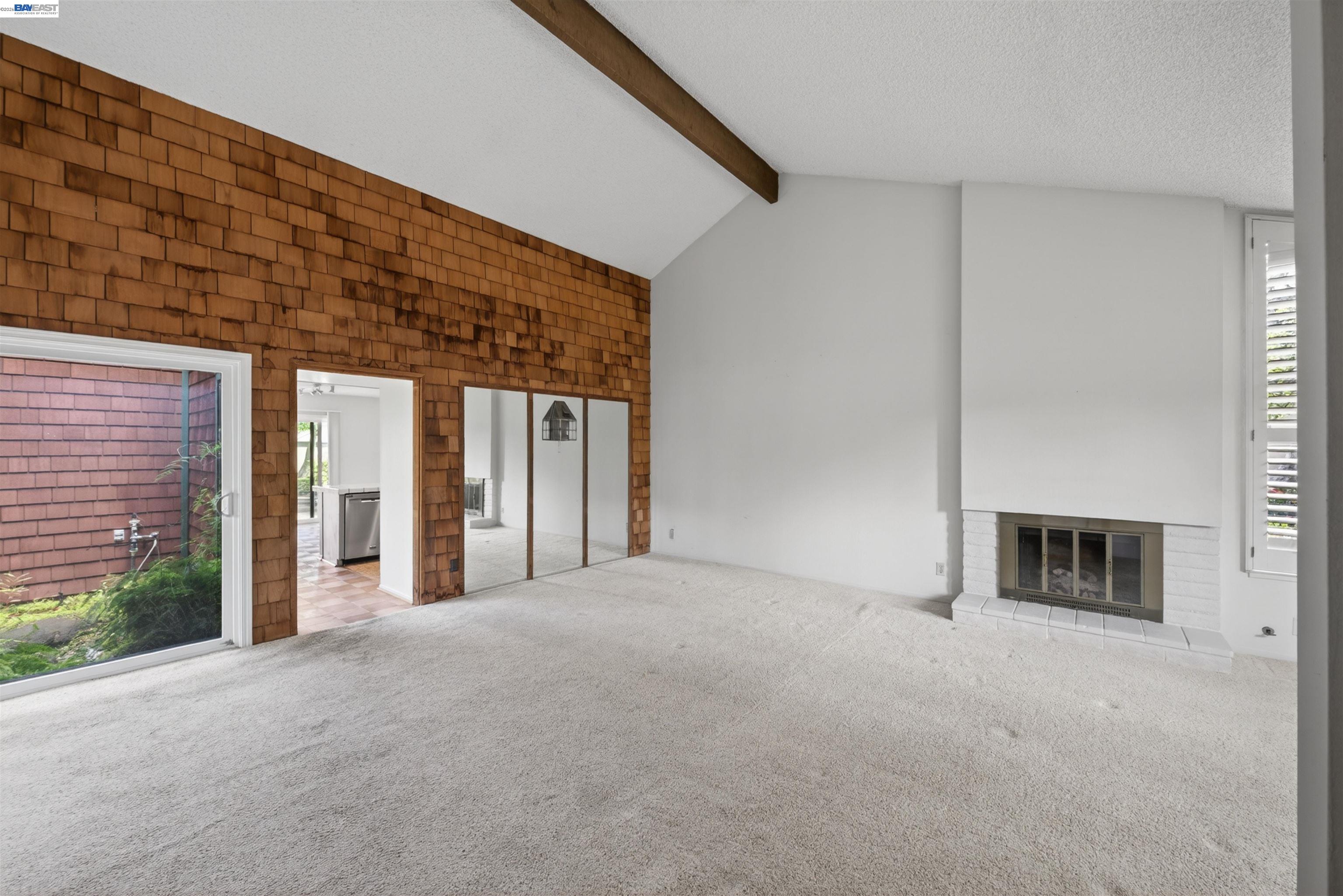 202 Baywood Road Alameda, CA 94502 - Photo 9 of 26 a view of an empty room with a fireplace