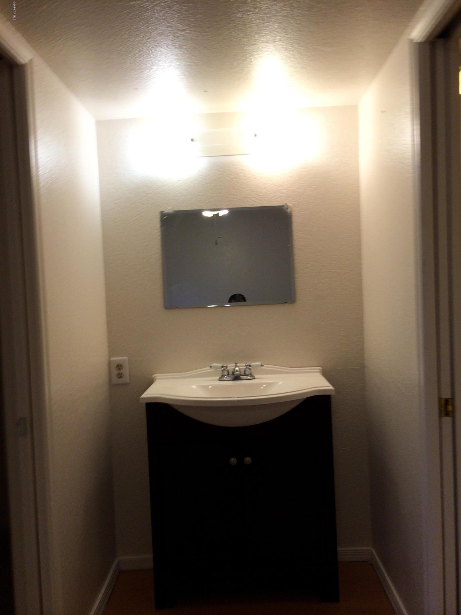 19601 North 7th Street, Unit 1085 Phoenix, AZ 85024 - Photo 14 of 23 a bathroom with a sink and a mirror