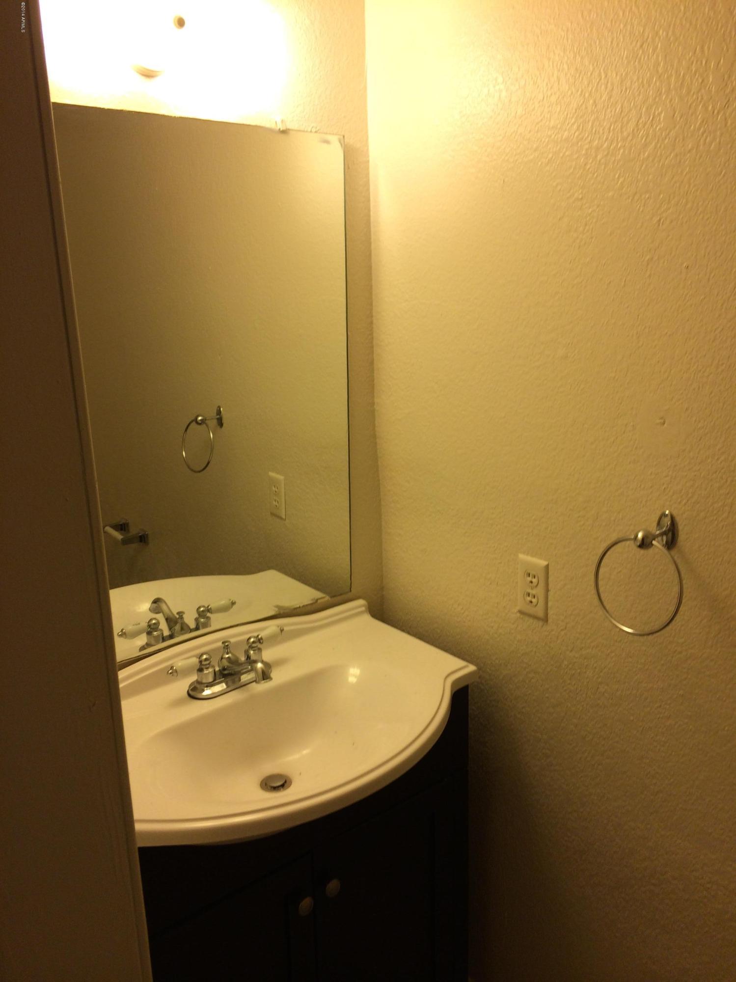 19601 North 7th Street, Unit 1085 Phoenix, AZ 85024 - Photo 2 of 23 a bathroom with a sink and mirror