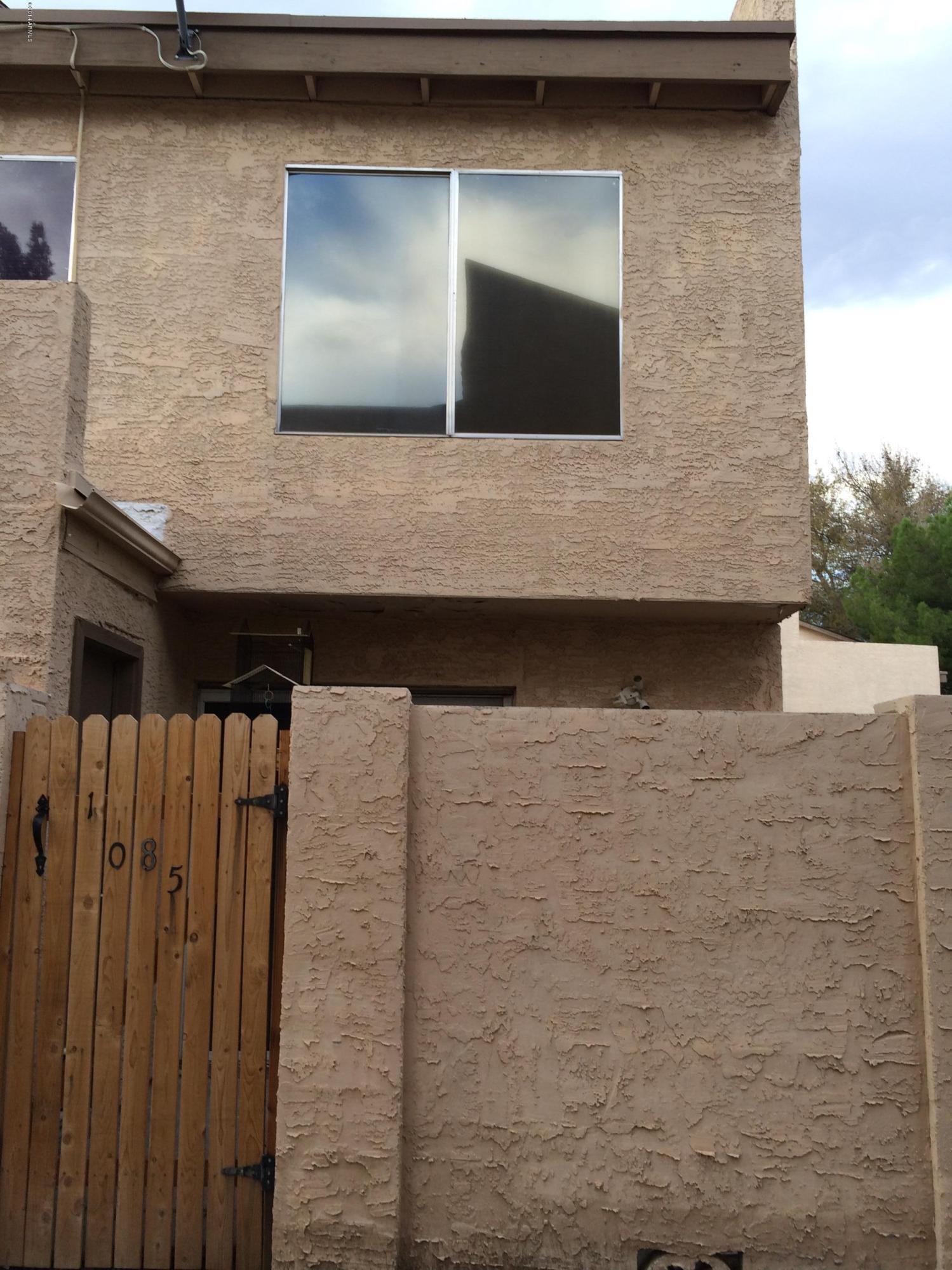 19601 North 7th Street, Unit 1085 Phoenix, AZ 85024 - Photo 21 of 23 a brick house with a door