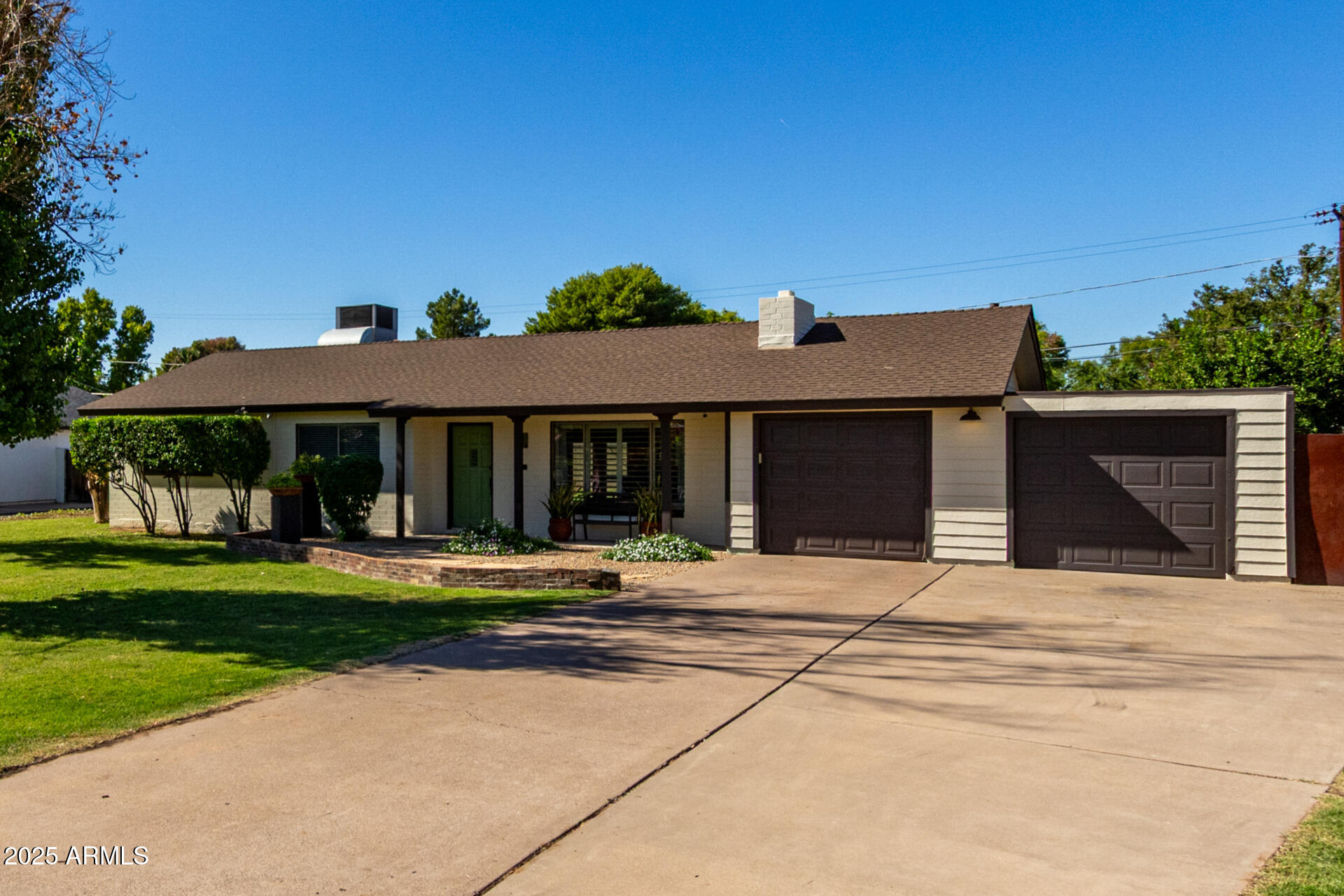 3718 North 36th Street Phoenix, AZ 85018 - Photo 1 of 37 a front view of a house with a yard