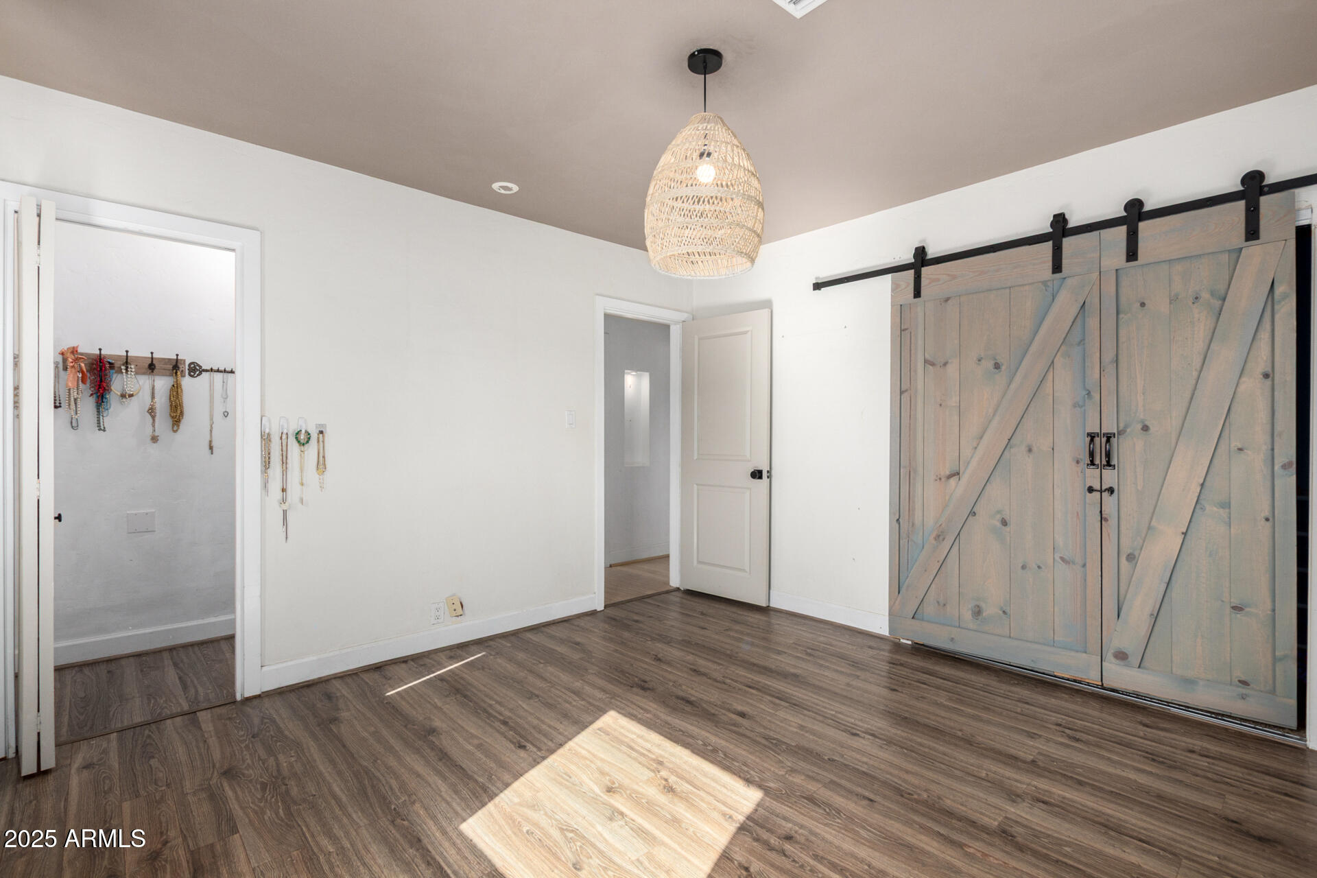 3718 North 36th Street Phoenix, AZ 85018 - Photo 12 of 37 a view of an empty room with wooden floor