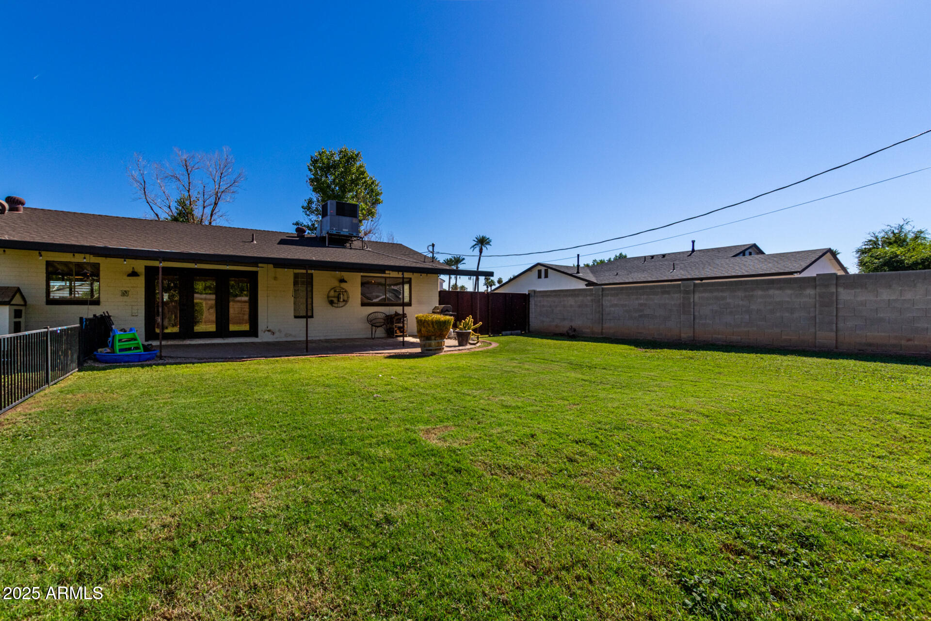 3718 North 36th Street Phoenix, AZ 85018 - Photo 20 of 37 a view of a house with a backyard