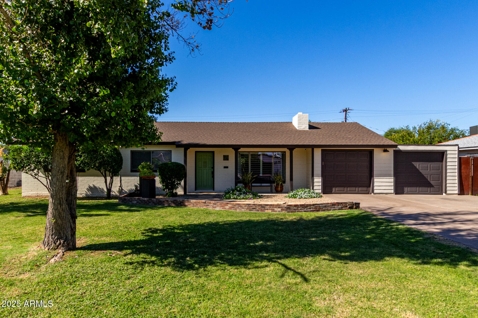 3718 North 36th Street Phoenix, AZ 85018 - Photo 2 of 37 a front view of a house with a yard