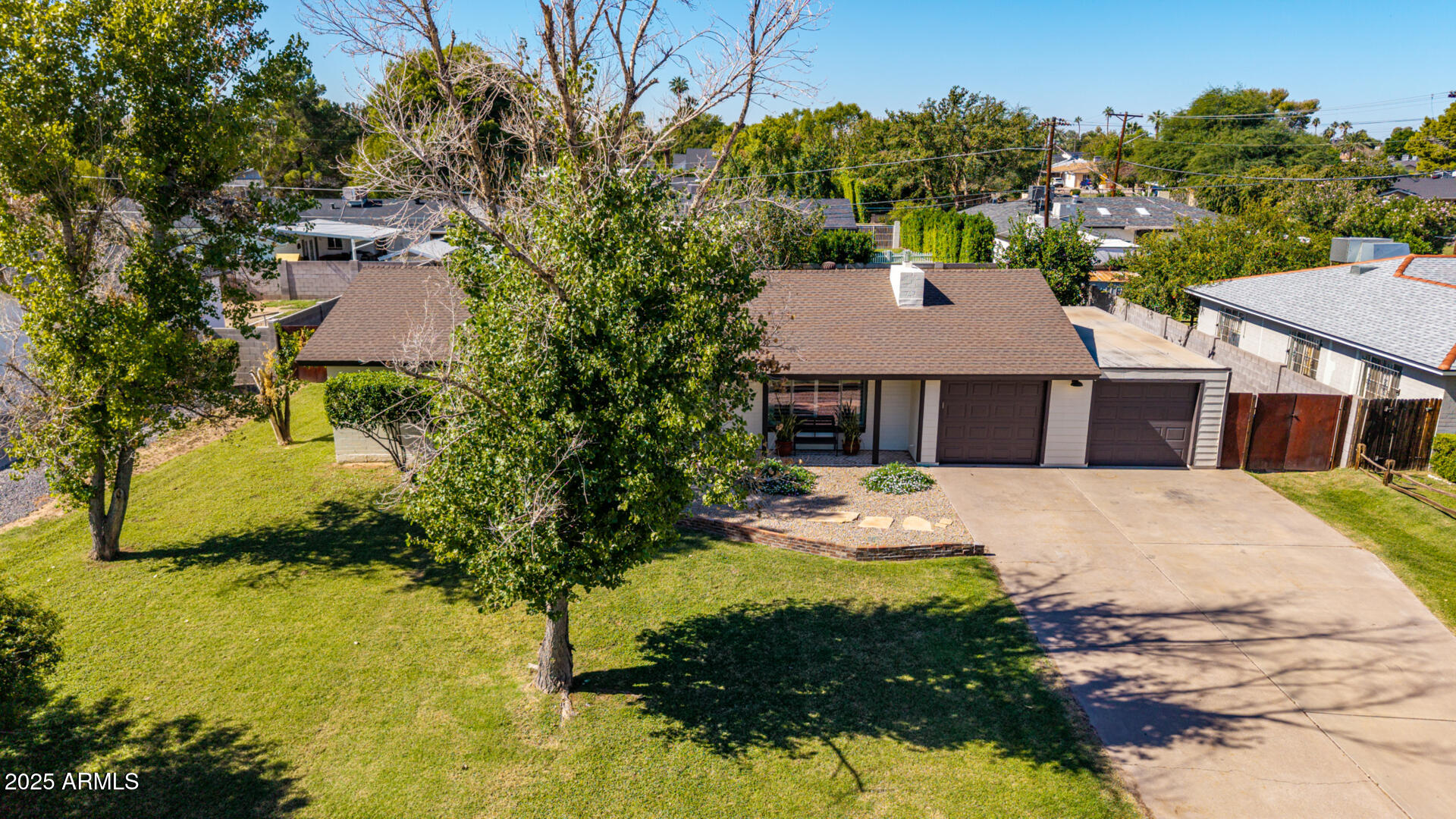 3718 North 36th Street Phoenix, AZ 85018 - Photo 22 of 37 a aerial view of a house with swimming pool and large trees
