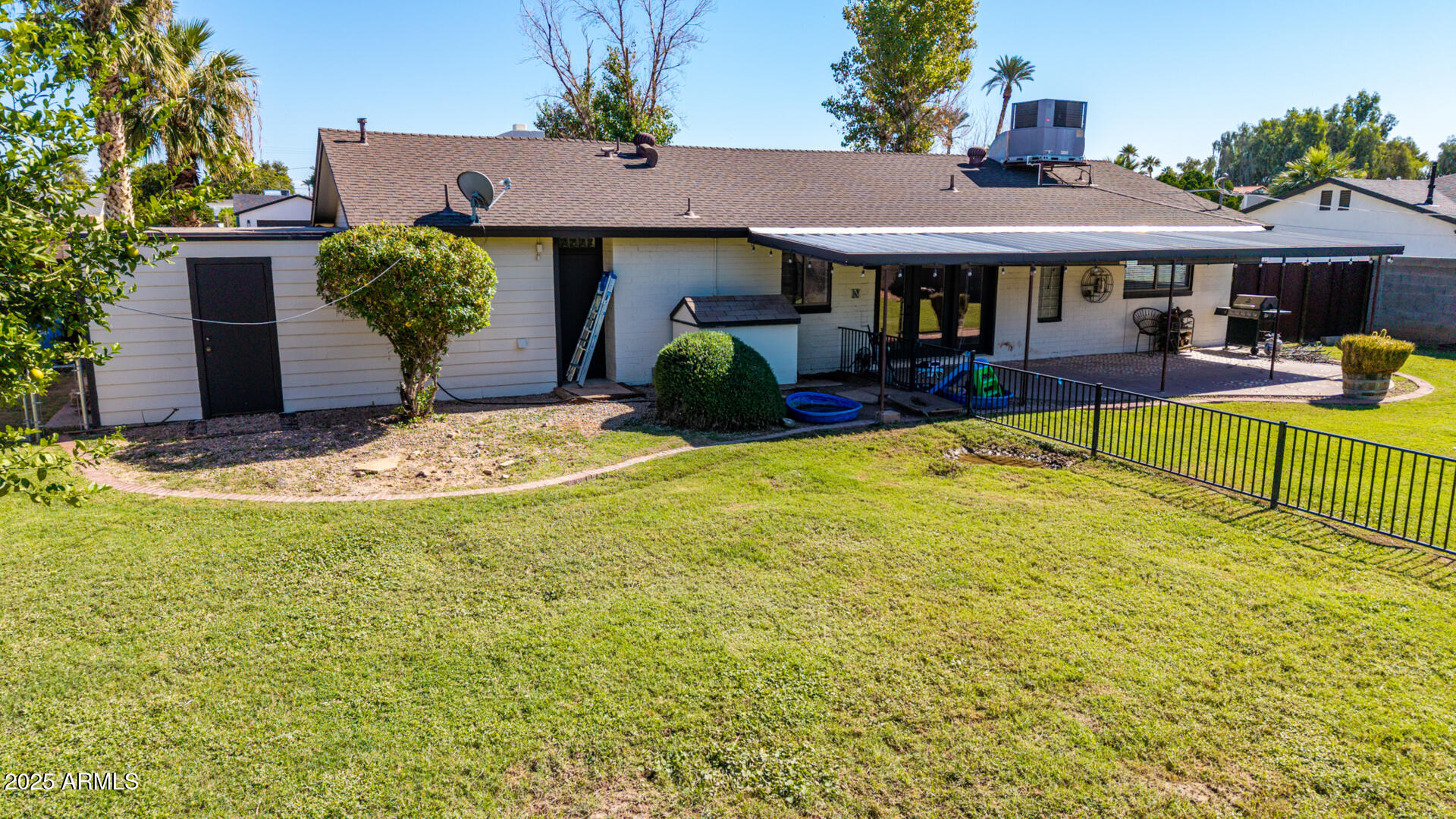 3718 North 36th Street Phoenix, AZ 85018 - Photo 24 of 37 a view of a house with swimming pool and sitting area