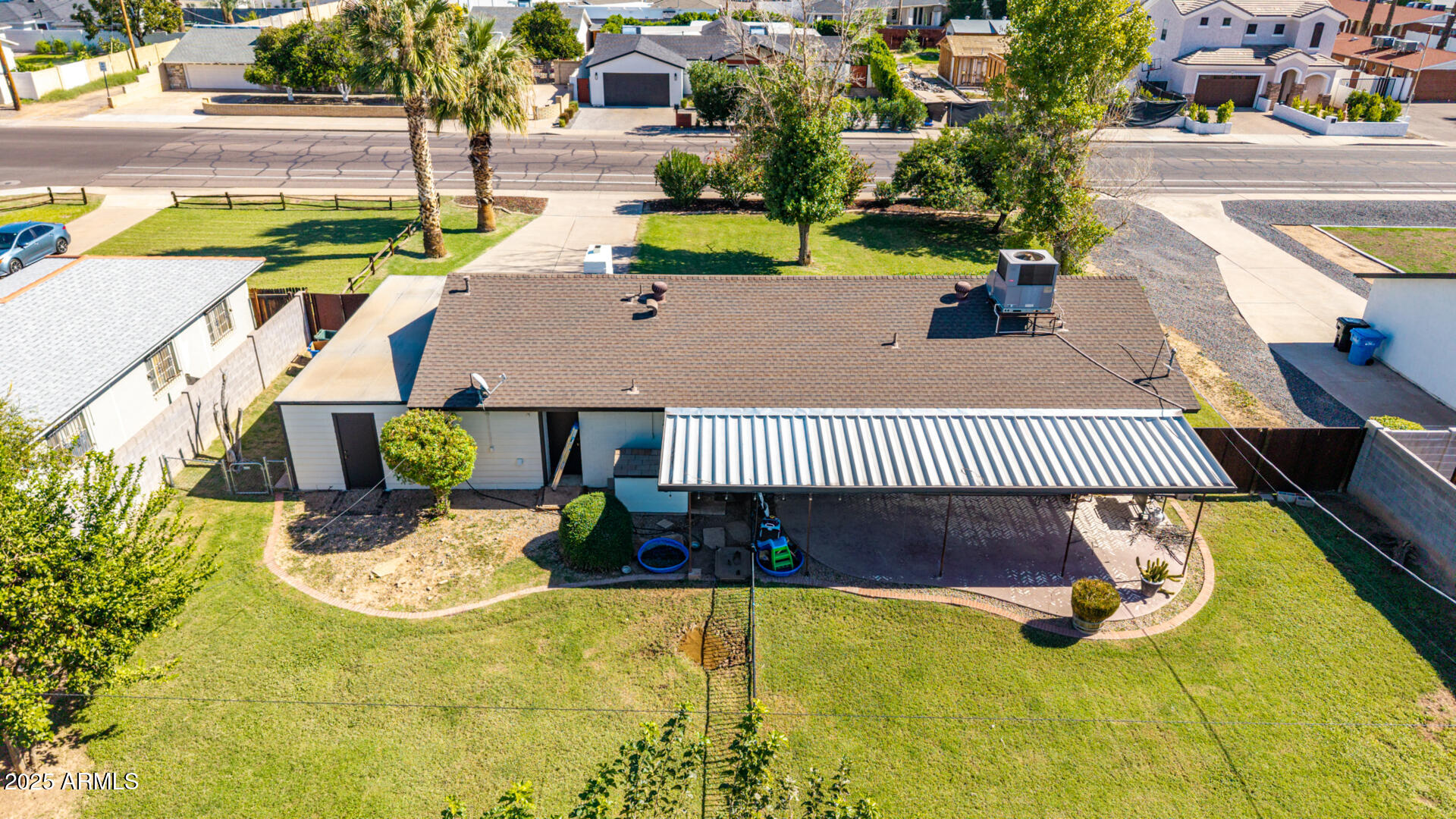 3718 North 36th Street Phoenix, AZ 85018 - Photo 27 of 37 a view of a swimming pool with potted plants and large tree