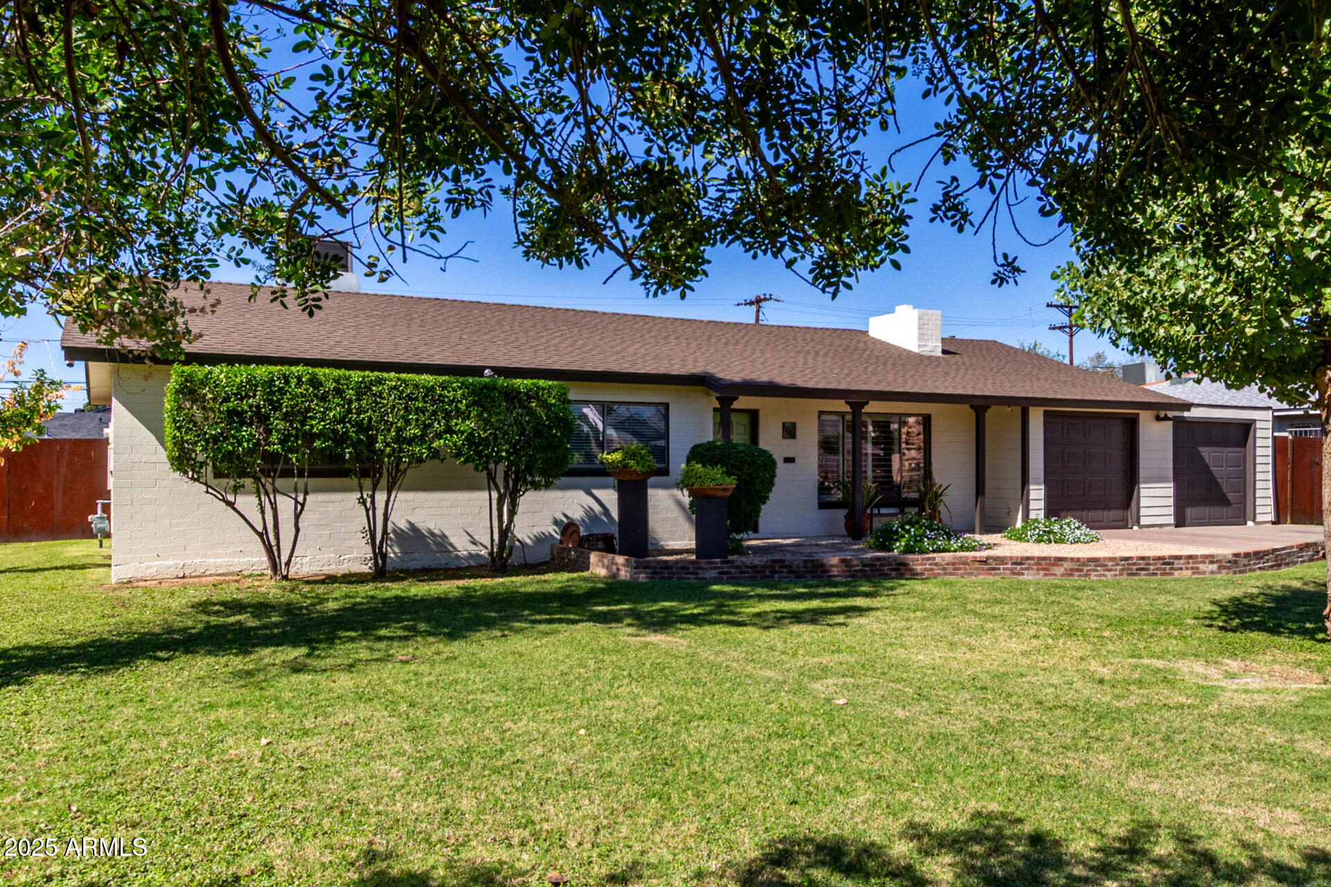 3718 North 36th Street Phoenix, AZ 85018 - Photo 3 of 37 front view of a house with a yard