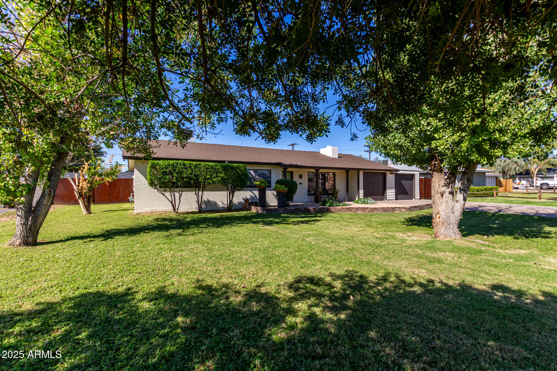 3718 North 36th Street Phoenix, AZ 85018 - Photo 4 of 37 a front view of a house with garden
