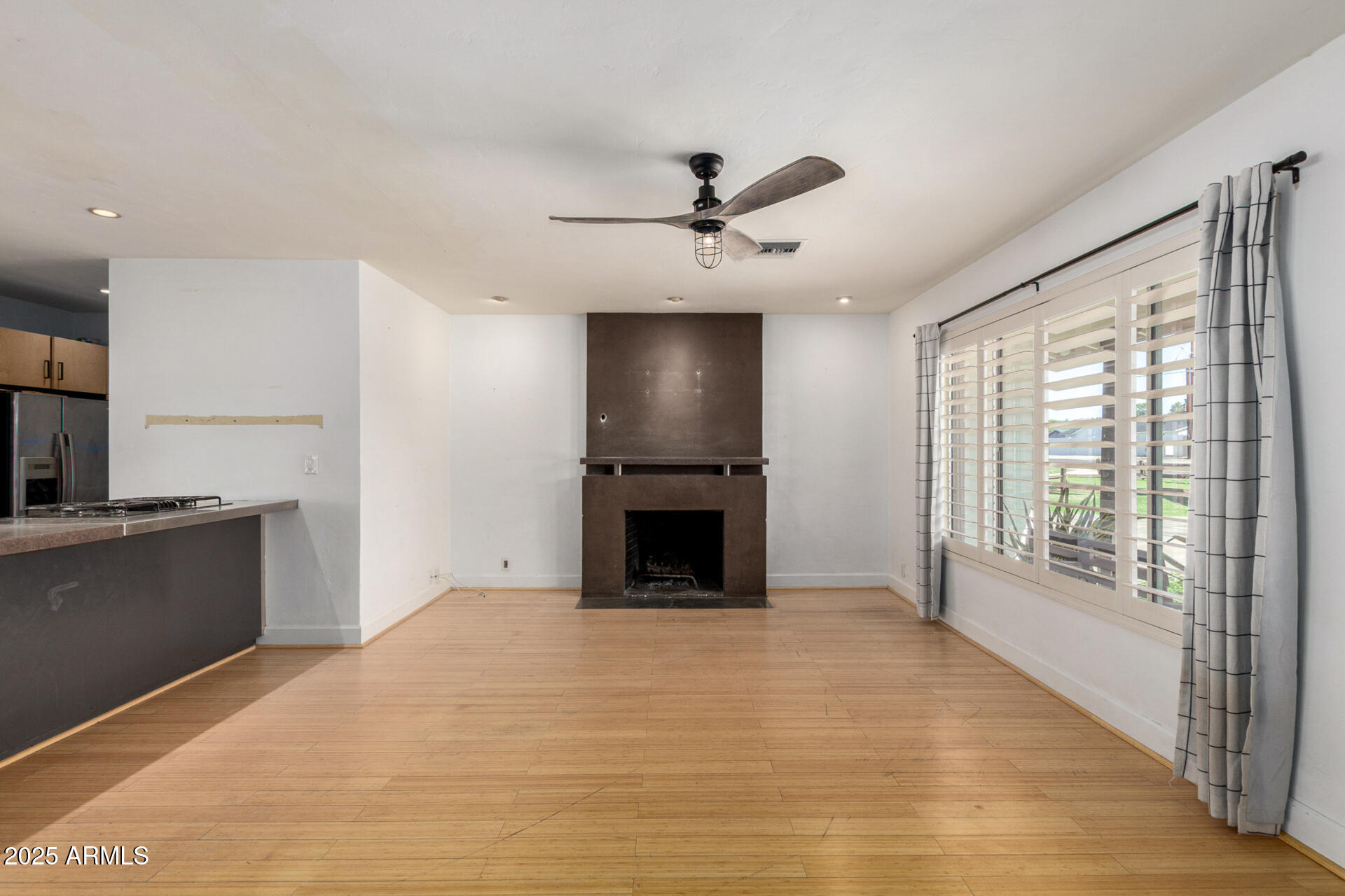 3718 North 36th Street Phoenix, AZ 85018 - Photo 7 of 37 a view of a kitchen with a sink and a fireplace