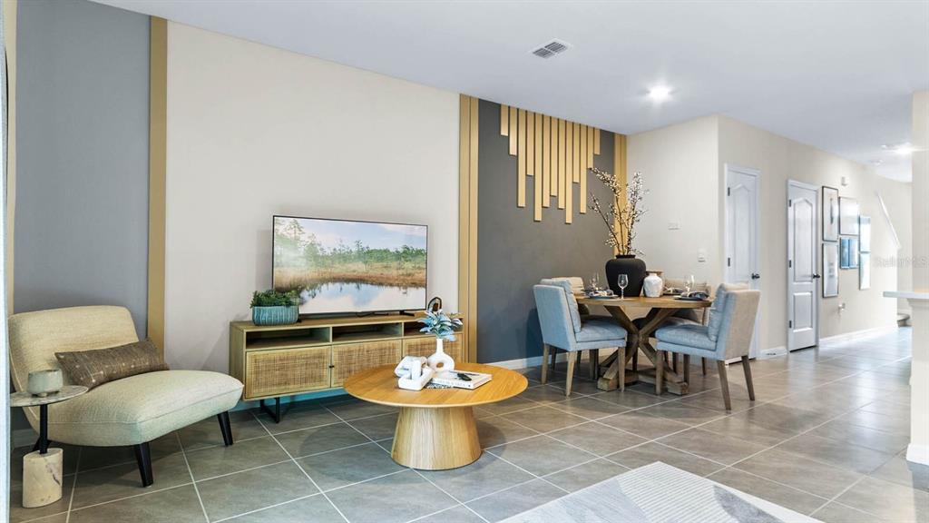 937 Spotted Egret Loop Ruskin, FL 33570 - Photo 11 of 22 a living room with furniture a rug and a table