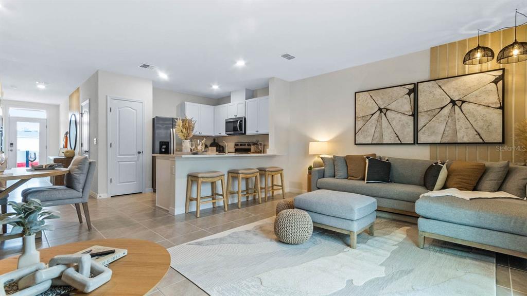 937 Spotted Egret Loop Ruskin, FL 33570 - Photo 13 of 22 a living room with furniture and a view of kitchen