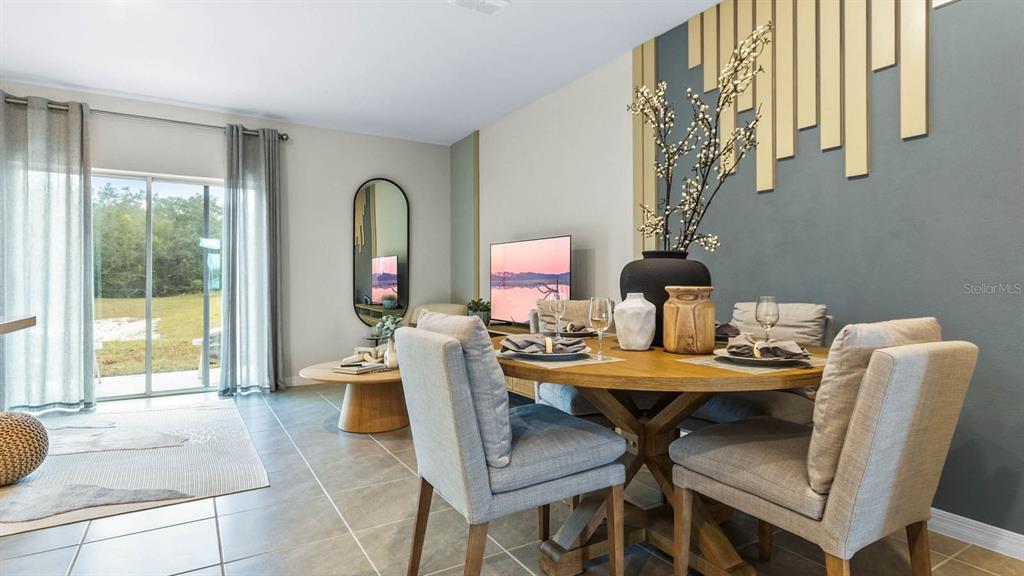 937 Spotted Egret Loop Ruskin, FL 33570 - Photo 10 of 22 a view of a dining room with furniture and a window