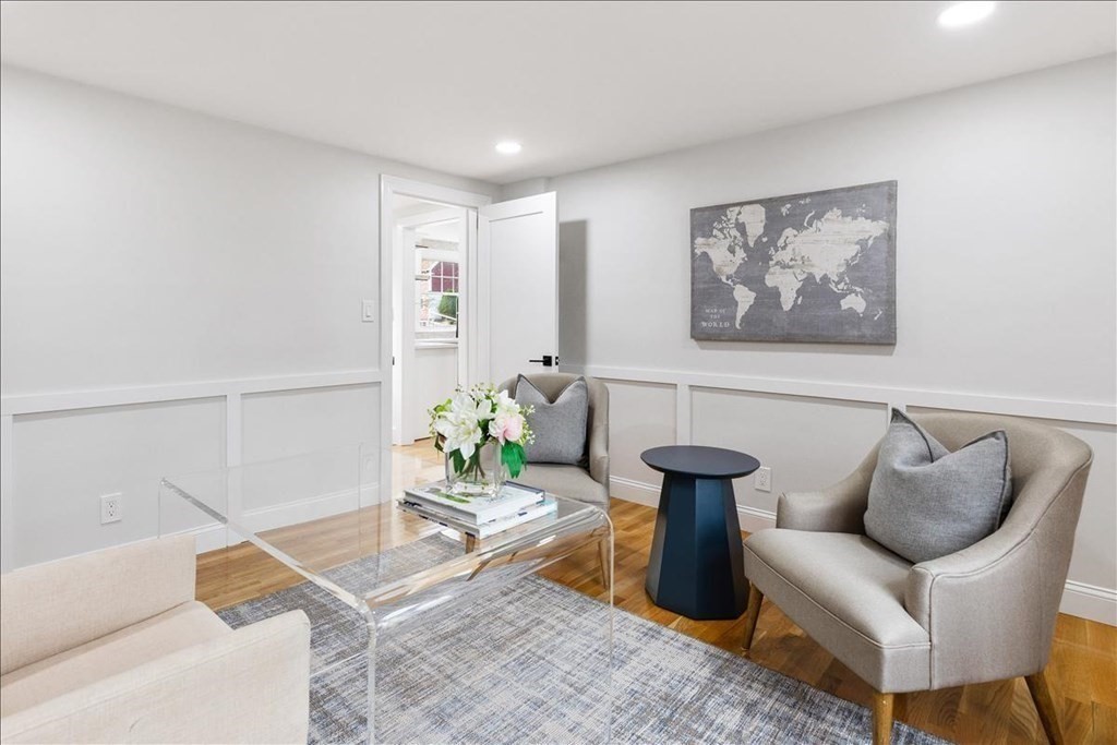 964 Main Street Hanover, MA 02339 - Photo 15 of 35 a living room with furniture and a potted plant