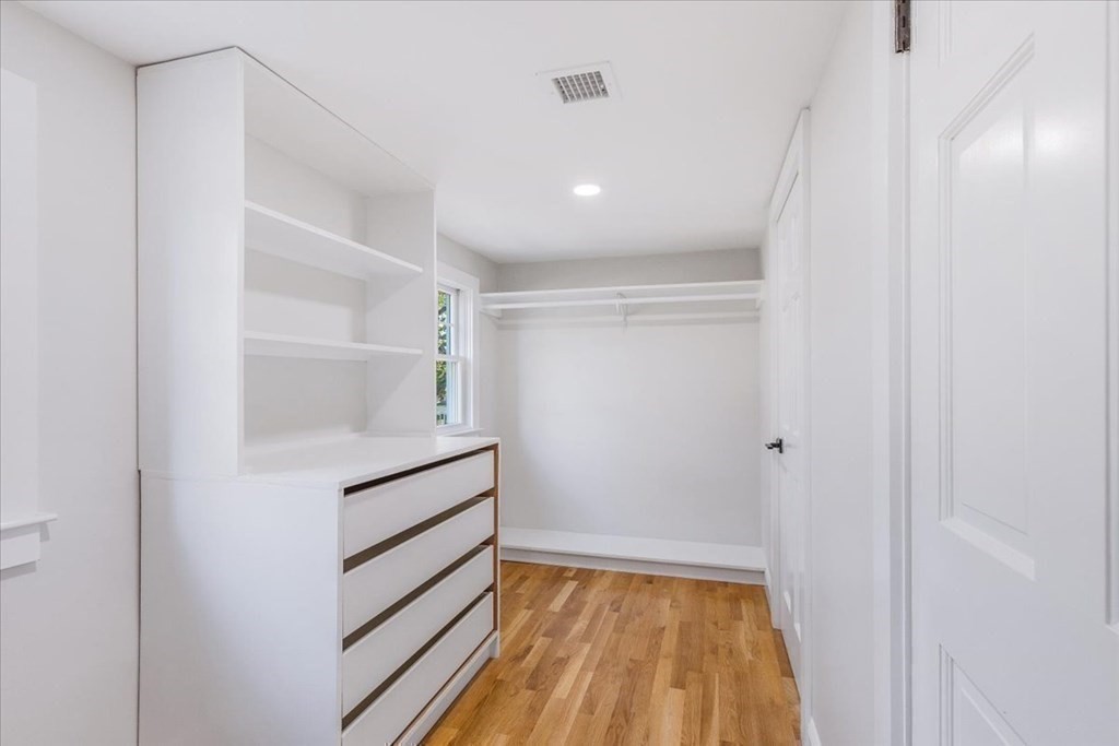 964 Main Street Hanover, MA 02339 - Photo 21 of 35 a view of walk in closet with empty racks