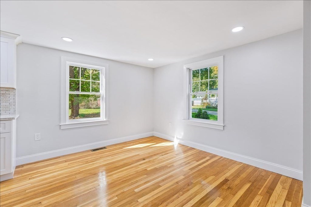 964 Main Street Hanover, MA 02339 - Photo 27 of 35 a view of an empty room with wooden floor and a window