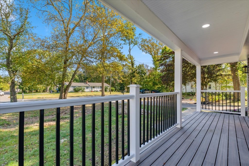 964 Main Street Hanover, MA 02339 - Photo 3 of 35 a view of a porch with wooden floor in front of a yard