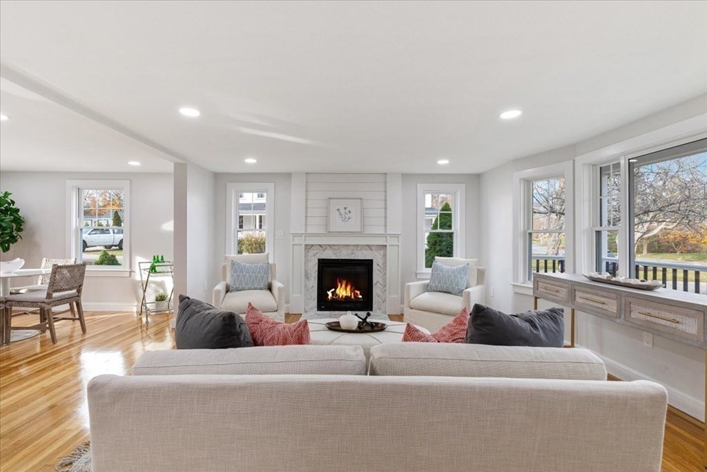 964 Main Street Hanover, MA 02339 - Photo 5 of 35 a living room with furniture large window and fireplace