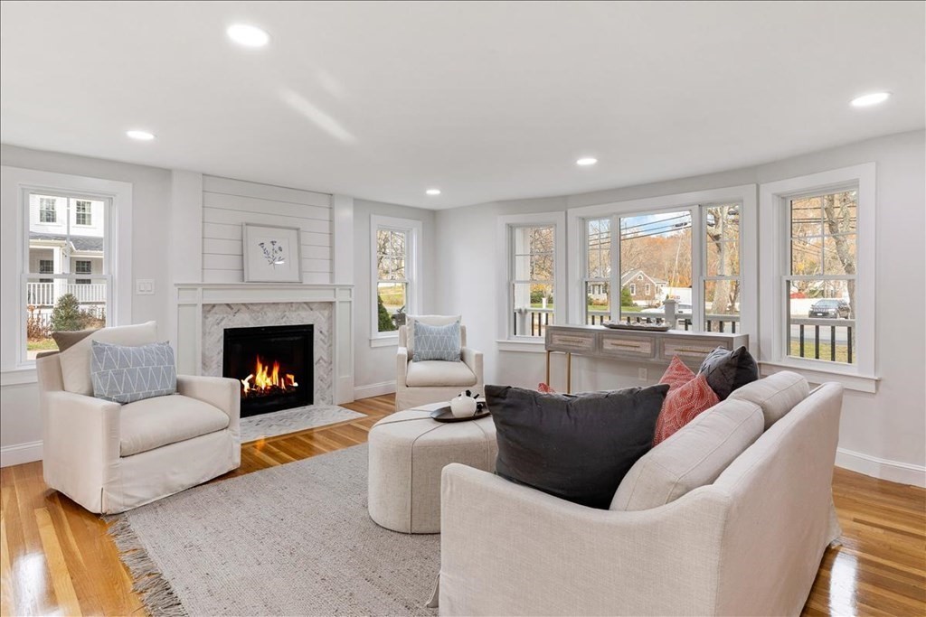 964 Main Street Hanover, MA 02339 - Photo 9 of 35 a living room with fireplace furniture and a large window