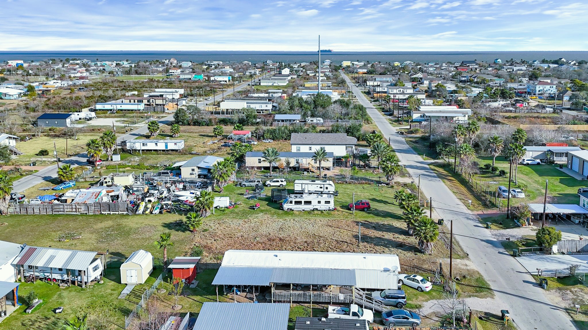 526 15th Street Dickinson, TX 77539 - Photo 2 of 12 an aerial view of a city with lots of residential buildings ocean and mountain view in back