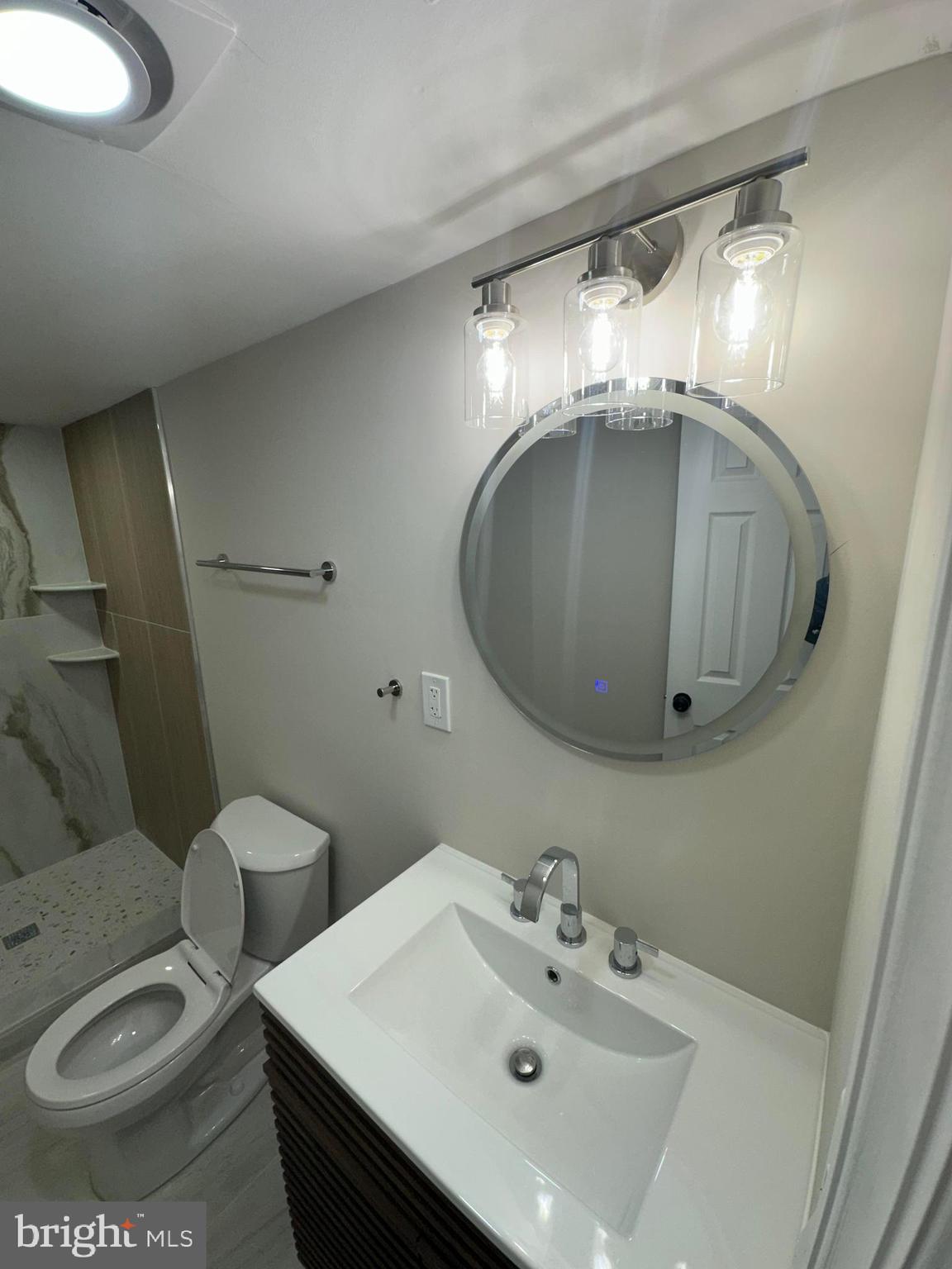 409 Cornwall Road Cherry Hill, NJ 08034 - Photo 14 of 26 a bathroom with a sink toilet and mirror