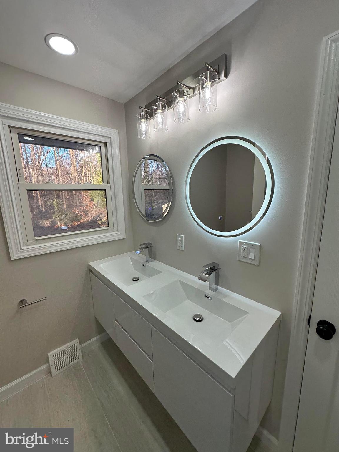 409 Cornwall Road Cherry Hill, NJ 08034 - Photo 17 of 26 a bathroom with a sink and a mirror
