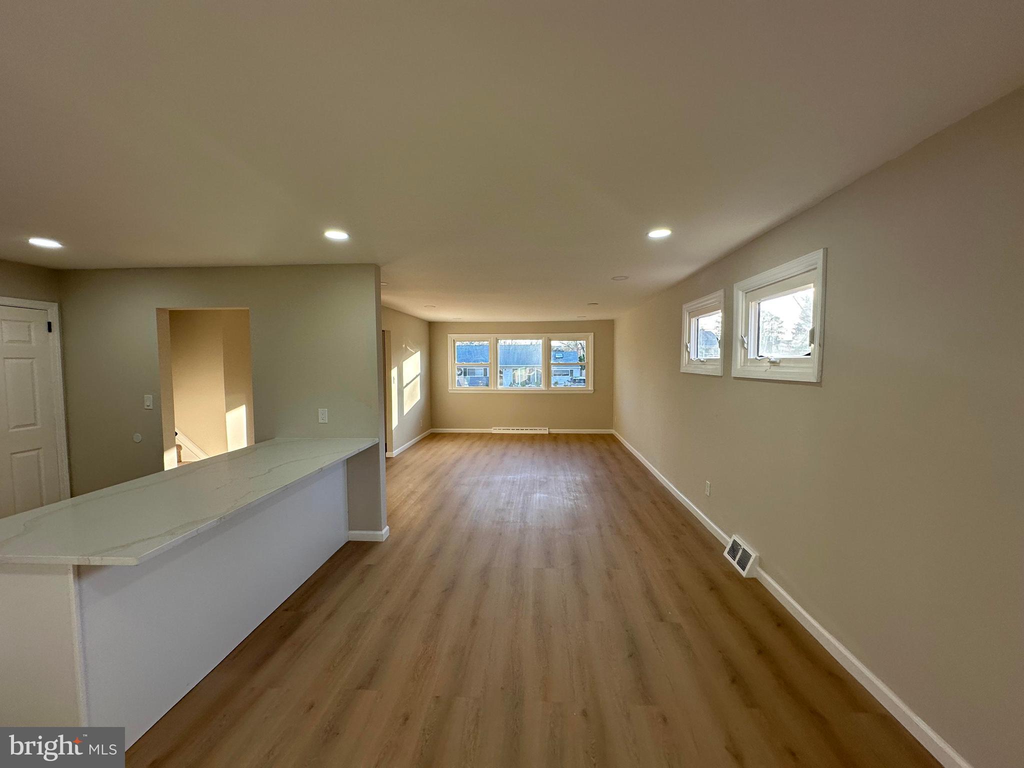 409 Cornwall Road Cherry Hill, NJ 08034 - Photo 7 of 26 wooden floor in an empty room with a window
